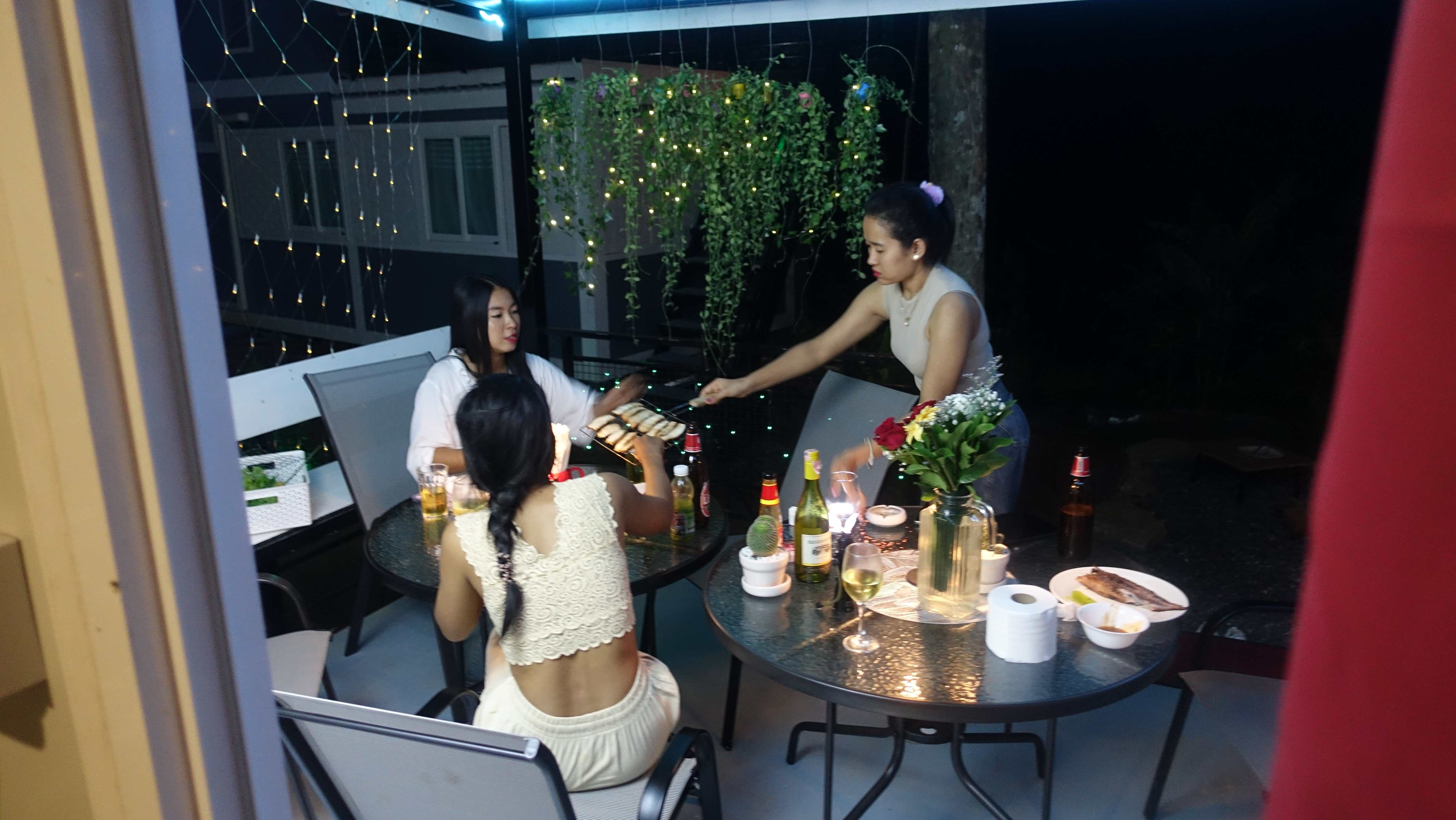Guests being served food on the terrace